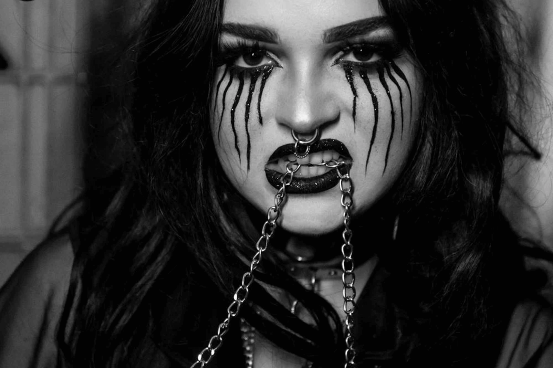 Photo by Caique Araujo from Pexels: https://www.pexels.com/photo/woman-wearing-a-halloween-costume-with-a-chain-in-her-mouth-18803302/